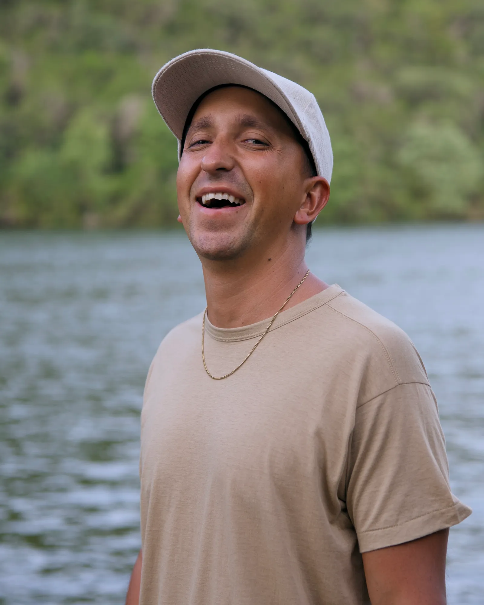 Kyle Lasota laughing by the water